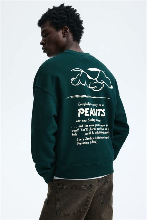 Men’s Dark green/Snoopy Oversized Fit Printed sweatshirt | H&M IN