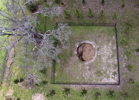 2/28/13 A large sinkhole opened underneath Jeffrey Bush's bedroom,despite efforts to save him by ...