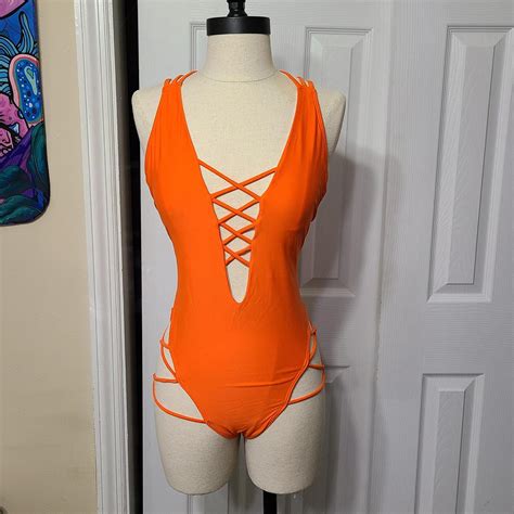 Medium neon orange one-piece swimsuit. - Depop