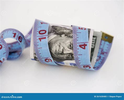 A One Hundred Dollar Bill with a Tape Measure Wrapped Around it Stock Image - Image of global ... - measurement of dollar bill