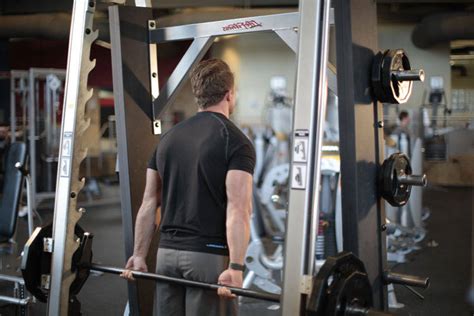 Smith Machine Behind the Back Shrug Exercise Guide and Video
