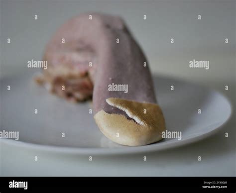 Boiled beef tongue on a plate. Process of peeling a beef tongue. Close up skin Stock Photo - Alamy