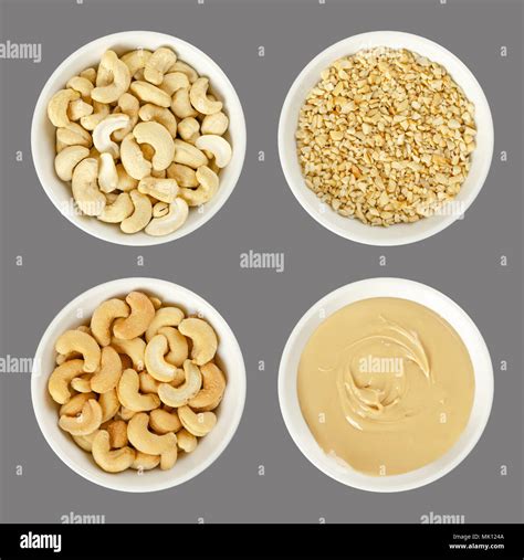 Cashew nuts in white porcelain bowls. Raw and processed nuts. Whole ...