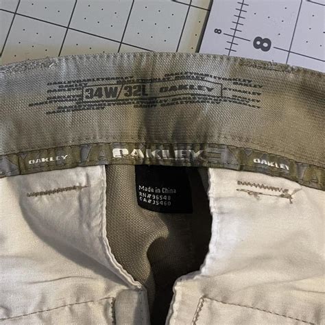 Oakley Men’s khaki golf pants, size 34x32 - Depop