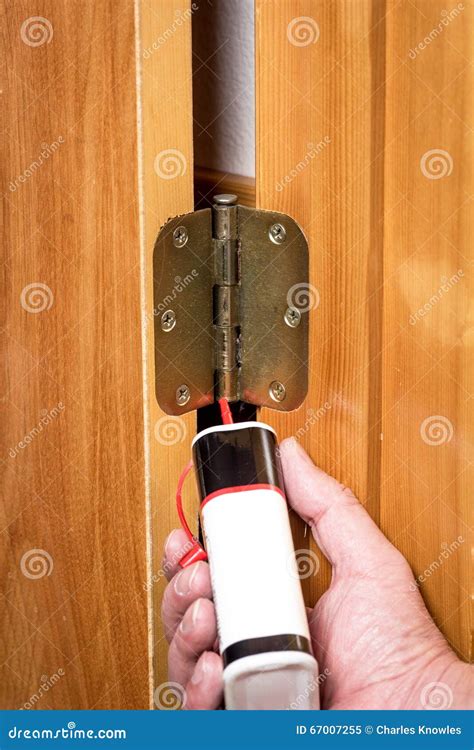 Showing How To Properly Oil a Door Hinge Stock Image - Image of ...