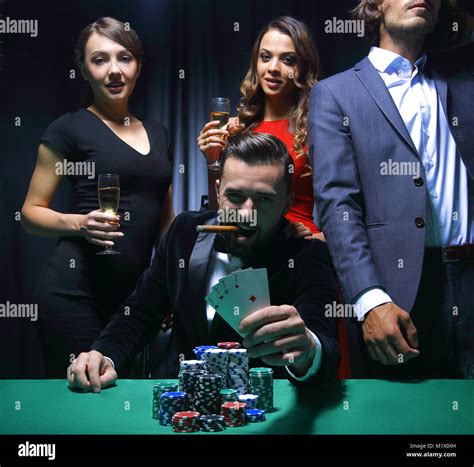 Rich handsome man smoking cigar and playing in the casino Stock Photo ...