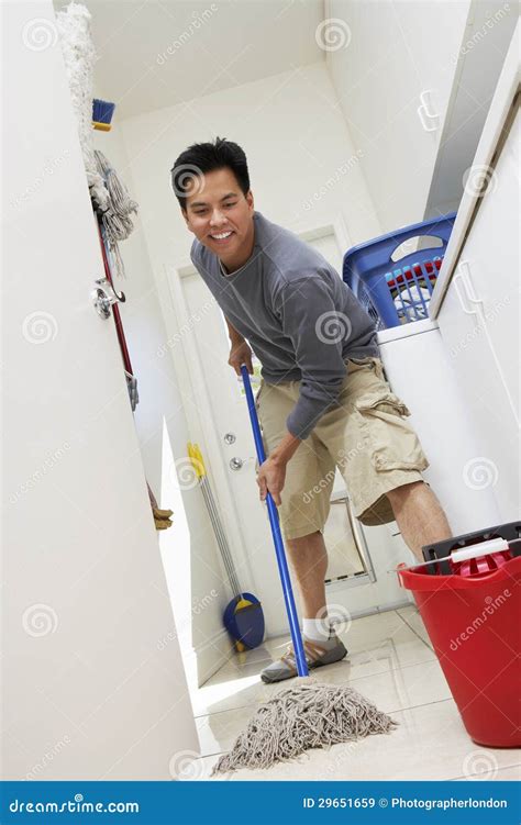 Man Sweeping Floor at Home stock image. Image of hygiene - 29651659