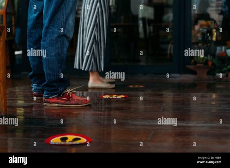 People stand in lines at an Upper East Side grocery store in New York.