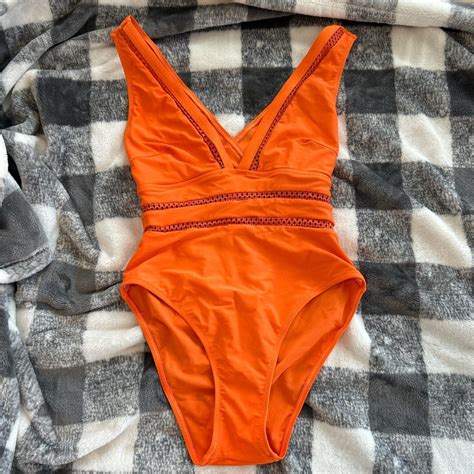 Neon orange one-piece swimsuit with crisscross... - Depop