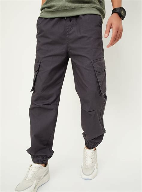 Buy Boys Solid Relaxed Fit Cargo Joggers Online at just Rs. 899.0 ...