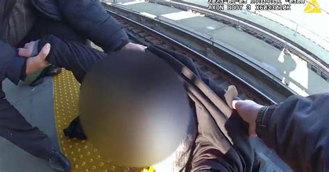 Video: NYPD officers rescue man who fell onto subway tracks in Brooklyn ...