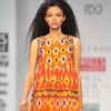A model showcases a creation by designer Tanvi Kedia on Day 3 of the ...