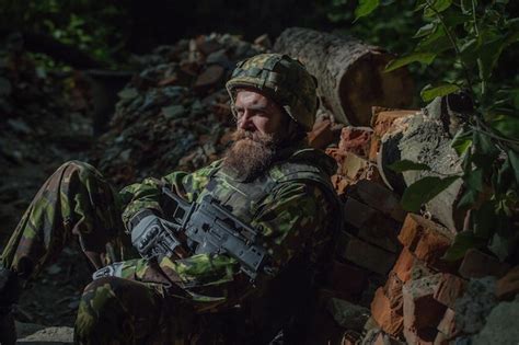 Young soldier with gun | Premium Photo