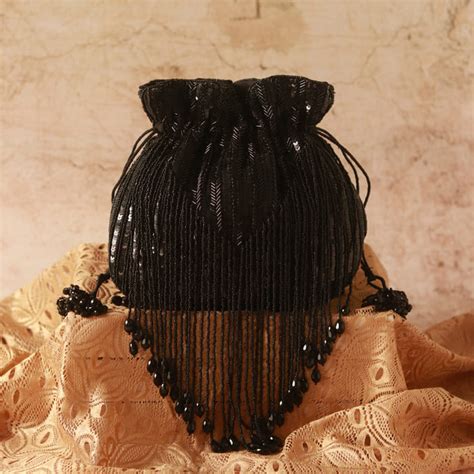 THE TAN CLAN Twinkle Heavy Tassles Potli with Handle - Black