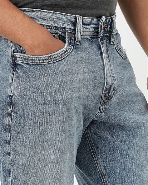 Nico Tapered Fit Mid Rise Mid Wash Blue Jeans