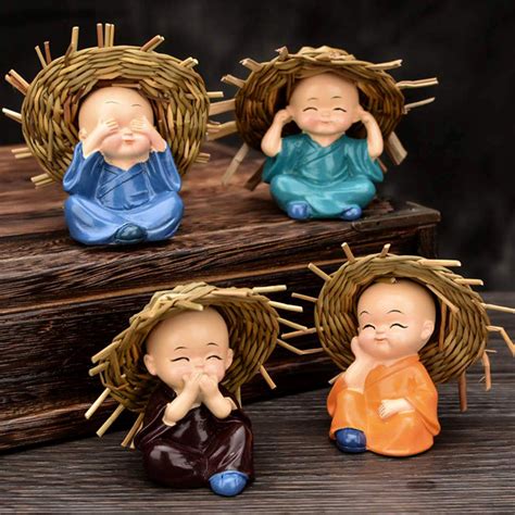 Decorative Resin Monk Buddha Showpiece Set of 4 with Traditional Straw