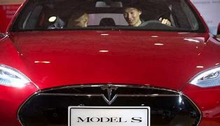 Image result for US opens investigation into Tesla seat belt issues