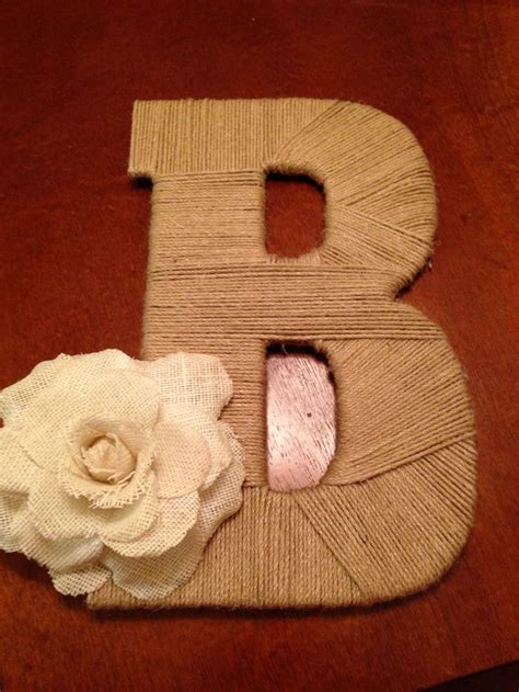 A wooden letter from Hobby Lobby wrapped in twine. Add flowers, beads ...