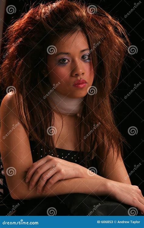 Pensive wild hairdo asian stock image. Image of lips, model - 606853