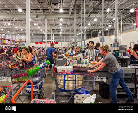 Costco warehouse interior view of customers checking out and shopping ...