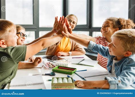 Teacher and Joyful Students Celebrate Successful Completion of ...