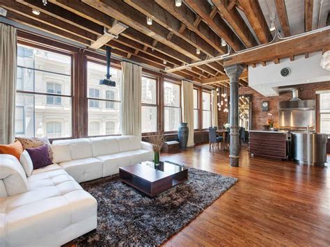 Open Plan Apartment with Exposed Wood Beams and Iron Columns