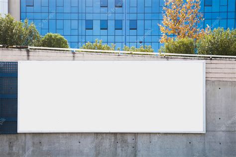 Empty billboard on concrete wall for advertisement | Premium Photo