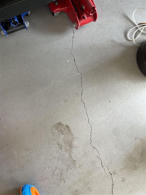 Crack in garage floor, it seems to be getting bigger but I’m not sure ...