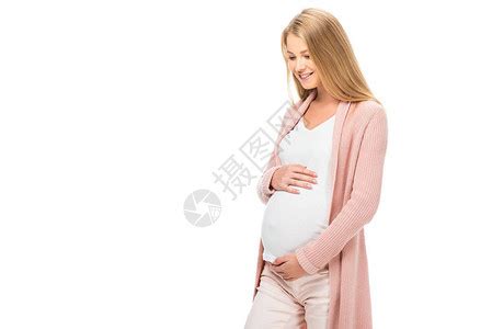 孕妇抚摸肚子微笑和看着在白色上被高清图片下载-正版图片502712180-摄图网