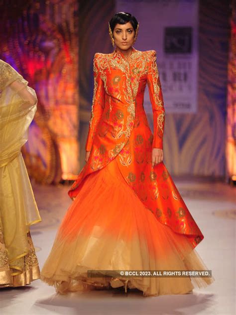 Jesse Randhawa showcases a creation by designer Gaurav Gupta on Day 5 ...