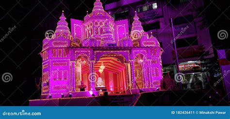 Temple at night illuminated with light from decorations