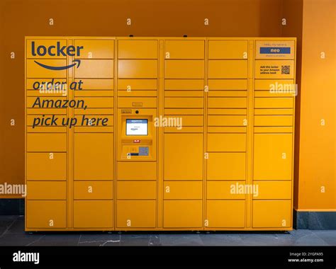 Orange Amazon Secure Lockers of various sizes located in a shopping ...