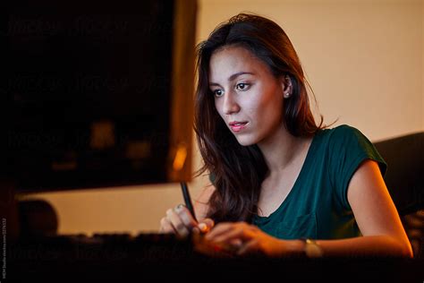 "Beautiful Young Woman Working On A Computer" by Stocksy Contributor "MEM Studio" - Stocksy