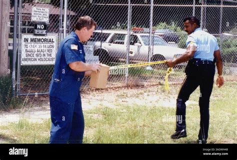 (FILE PHOTO) Members of the Pensacola Police Dept. secure the scene the ...