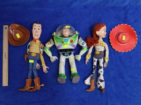 Lot - 3 TOY STORY FIGURES - WOODY, BUZZ LIGHTYEAR & JESSIE