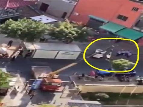 चीन: कोरोना संक्रमित शख्स को लंबे क्रेन से उठाकर पहुंचाया गया आइसोलेशन ...