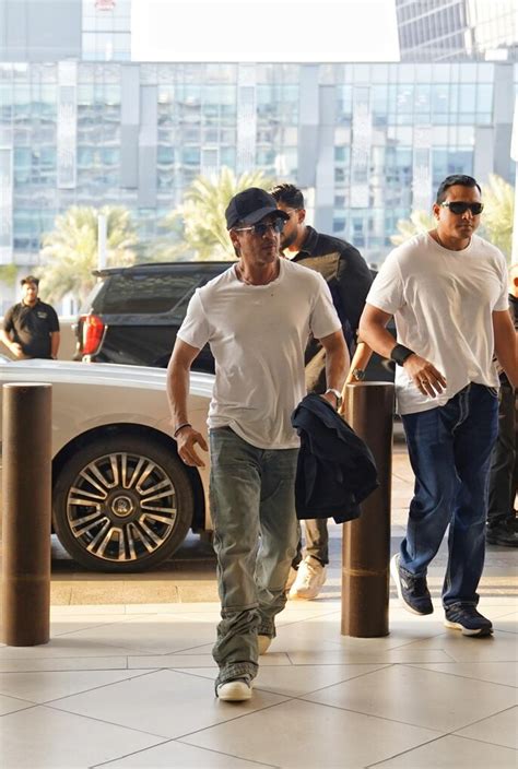 Shah Rukh Khan in his classic white tee-denim look as he arrives in ...