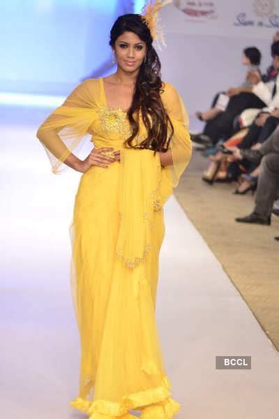 Model walks the ramp to showcase creation by designers Arjun and ...