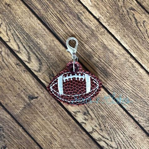 football zipper pulls