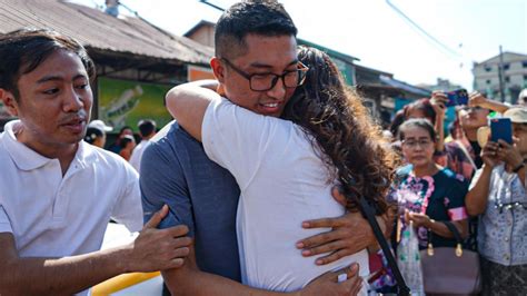 A released prisoner, right, is welcomed by her colleague after she was released from Insein Prison Sunday, Jan. 4, 2026, in Yangon, Myanmar. (AP Photo/Thein Zaw)