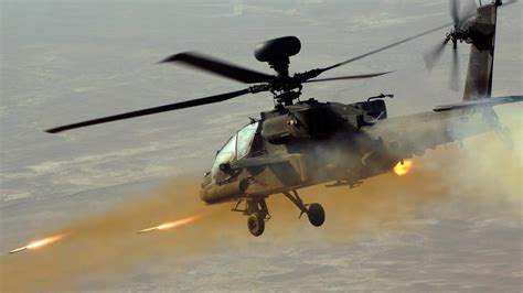 Aircraft army apache military helicopters rockets ah-64 firing ...