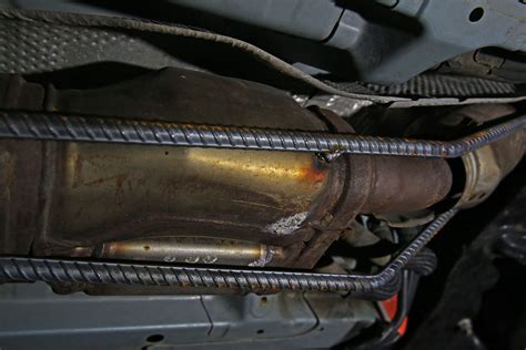 Where Is A Catalytic Converter Located On A Car