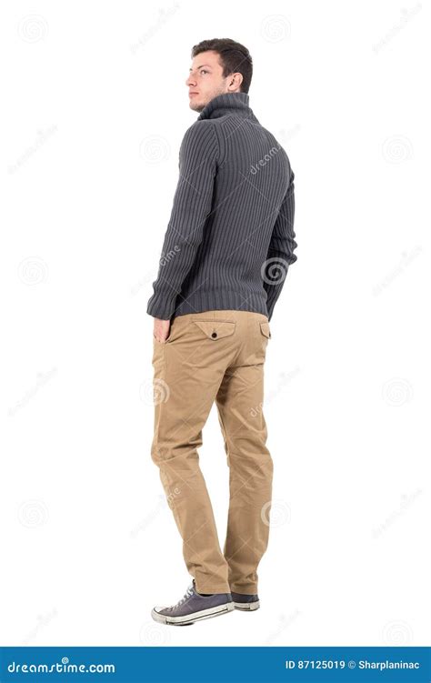 Rear View of Young Casual Man in Gray Sweater Looking Up Over Shoulder ...