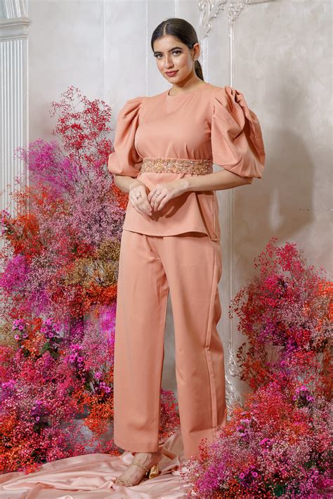 Light Orange Exaggerated Sleeve Top With Embellished belt and a pant ...