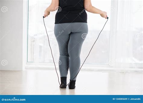 Overweight Woman with Jumping Rope Cardio Workout Stock Image - Image of cardio, jumpfit: 134085609
