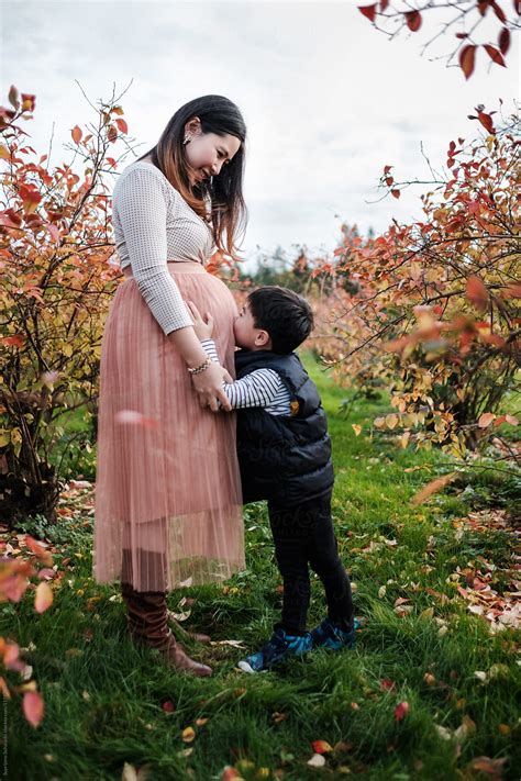 "Pregnant Asian Woman With Her Son Outdoor In A Park" by Stocksy ...