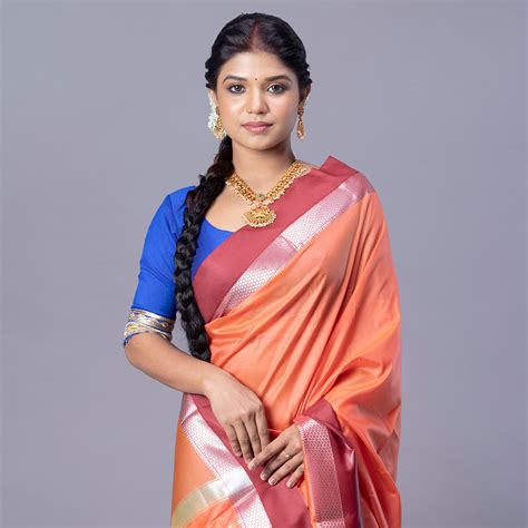 Kanjivaram silk saree in rust color with maroon and silver border – Boveee