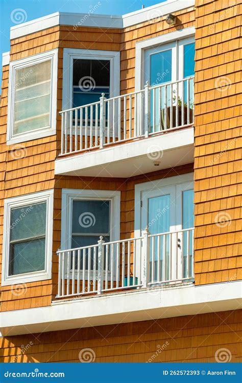 Light Brown Horizontally Slatted Timber Framed House with Balcony and ...