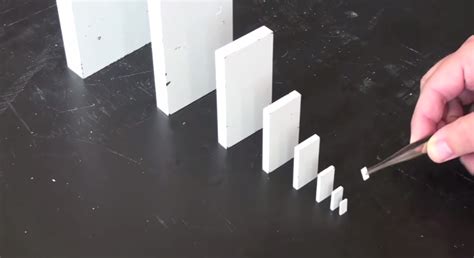 A Domino The Size Of A Tic Tac Could Topple A Building | Business Insider