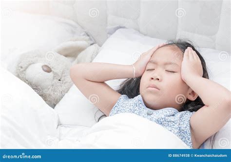 Child Lying Down Suffering from a Headache Stock Photo - Image of people, cold: 88674938